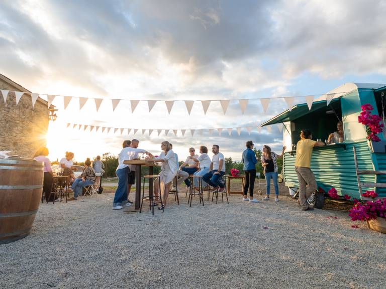Outdoor food truck gathering at sunset