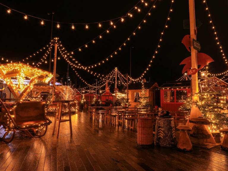 Outdoor Christmas market with string lights